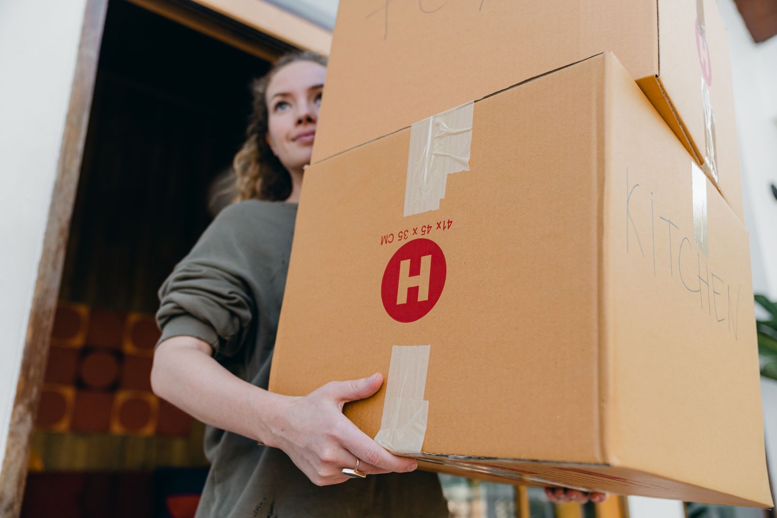 Flat-packed cartons, unprinted newsprint and packing tape ready for a move