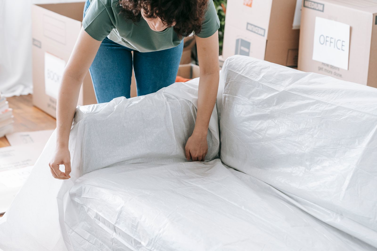 Furniture blanket-wrapped and shrink-sealed for transit