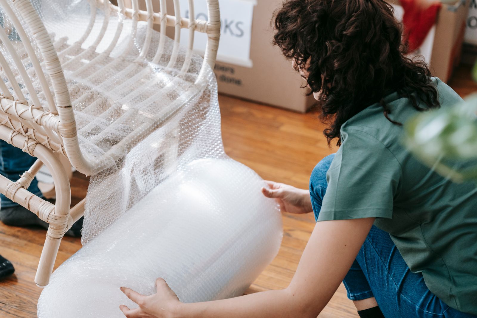 Furniture blanket-wrapped and shrink-sealed for transit
