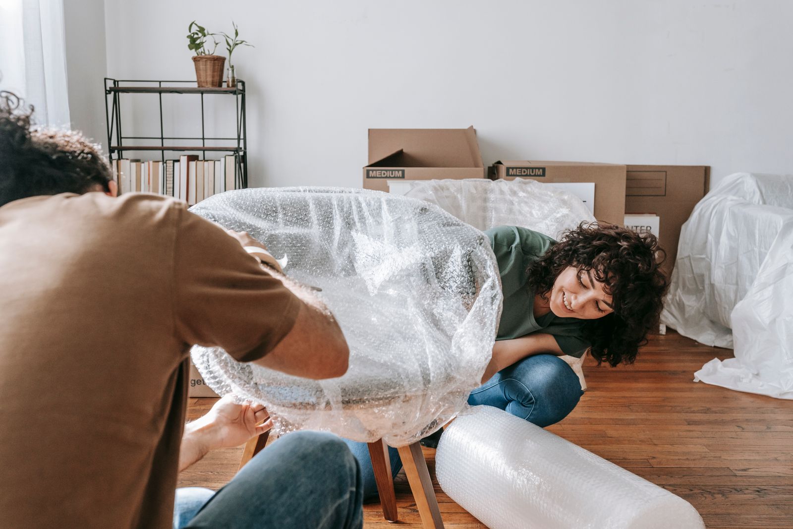 Furniture blanket-wrapped and shrink-sealed for transit